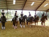 Quadrille day everyone got a Jodie Kelly Dressage shirt with monogram on he back.  So Gaby, Amelia and Lauren sat backwards for the picture to show off the logo.<br /><br />